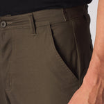 Close up of the rear pocket design and stitching on the mens green cotton cargo pants.