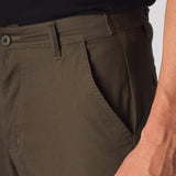 Close up of the rear pocket design and stitching on the mens green cotton cargo pants.