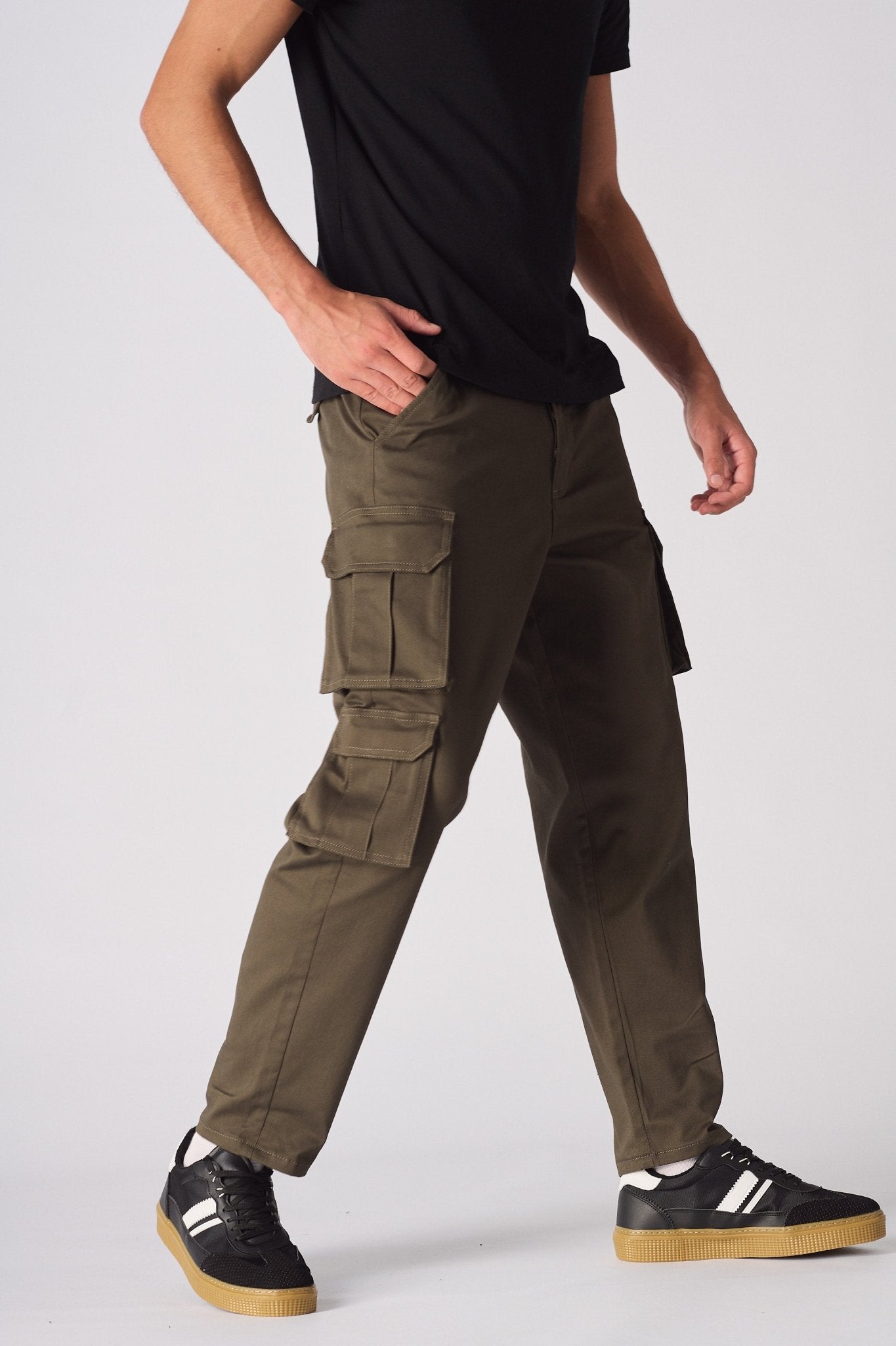 Rear view of the green cotton cargo pants showing the pocket placement and high-quality finish.