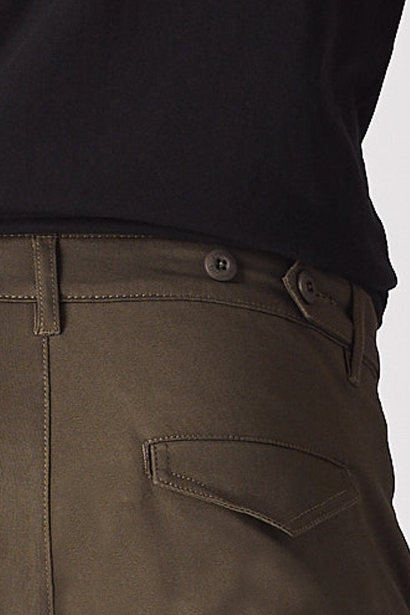 A man in a walking pose highlighting the flexible stretch fabric of the green cotton cargo pants.