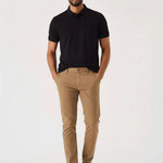 Man standing casually in light brown chinos men