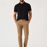 Man standing casually in light brown chinos men