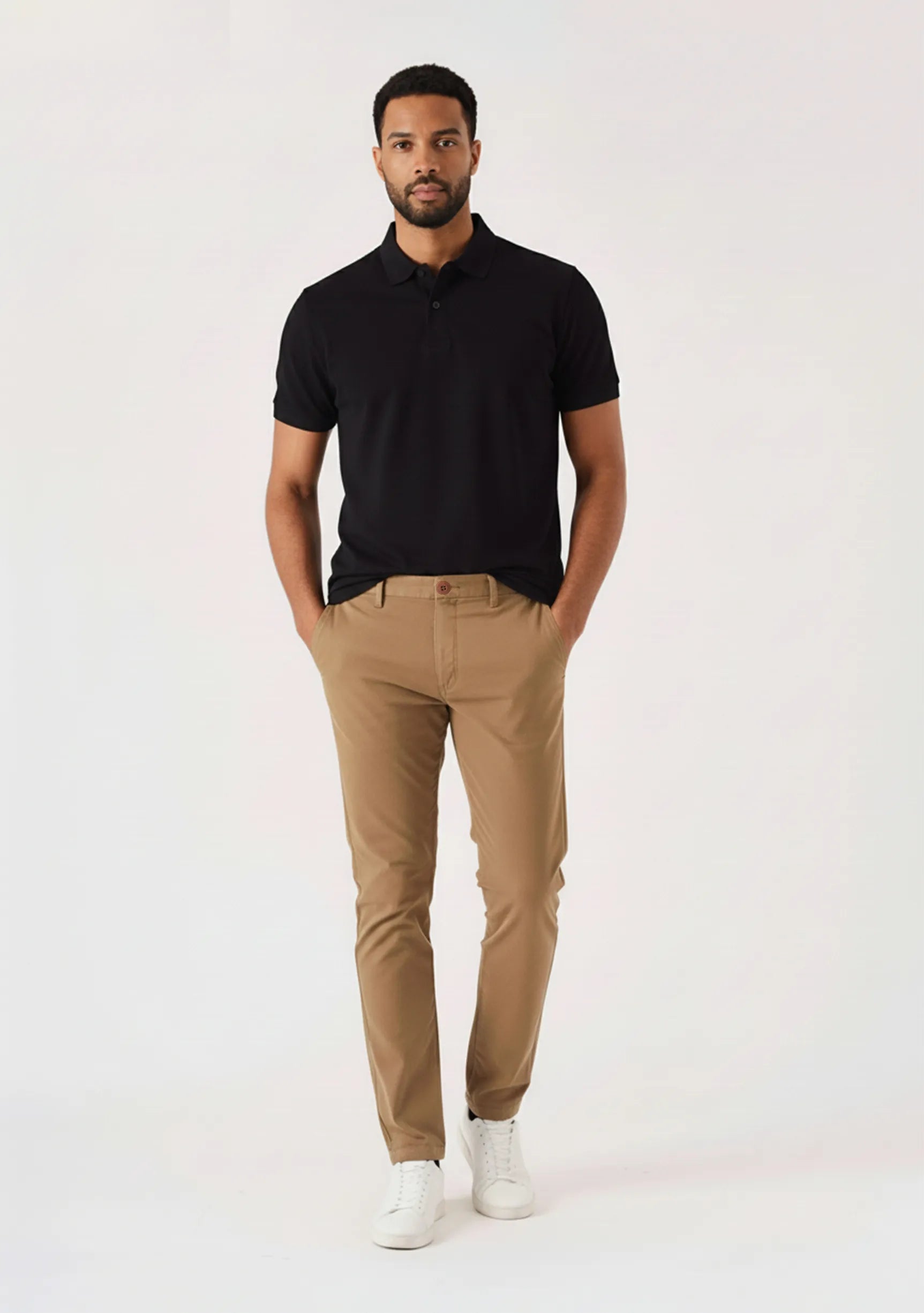 Man standing casually in light brown chinos men