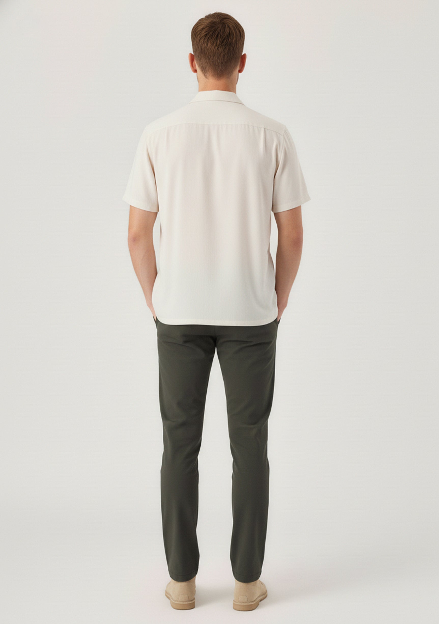 Full back shot of stylish mens olive trousers highlighting the modern slim fit silhouette.