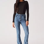 Front view of women's mid blue bootcut jeans featuring an exposed button fly