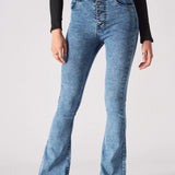 Close up of the high waist, front pockets, and exposed metal button fly on mid blue denim