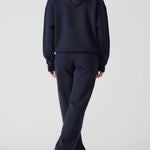 Rear view of an oversized navy hoodie for women showing the hood and fit