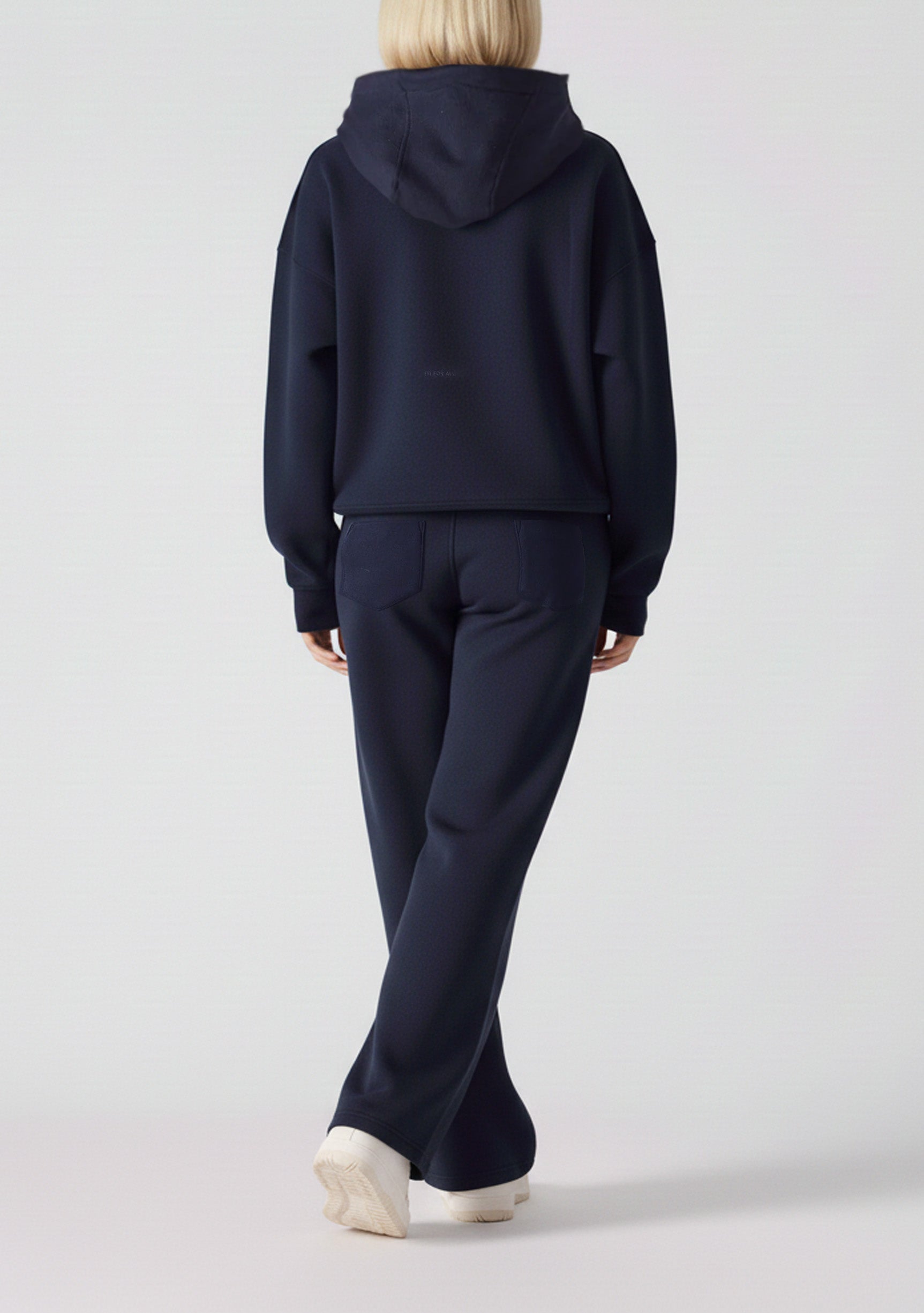 Rear view of an oversized navy hoodie for women showing the hood and fit