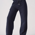 Front view of the waistband and drawstring on these navy wide leg joggers