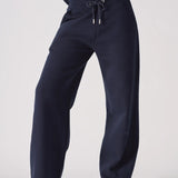 Front view of the waistband and drawstring on these navy wide leg joggers
