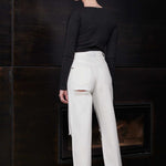 Back view of a model in the off-white distressed jeans for women.