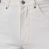 Close-up of the high waist and button fly on the off-white tapered jeans.