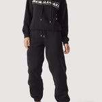 Full length shot of a woman in a premium oversized hoodie black.