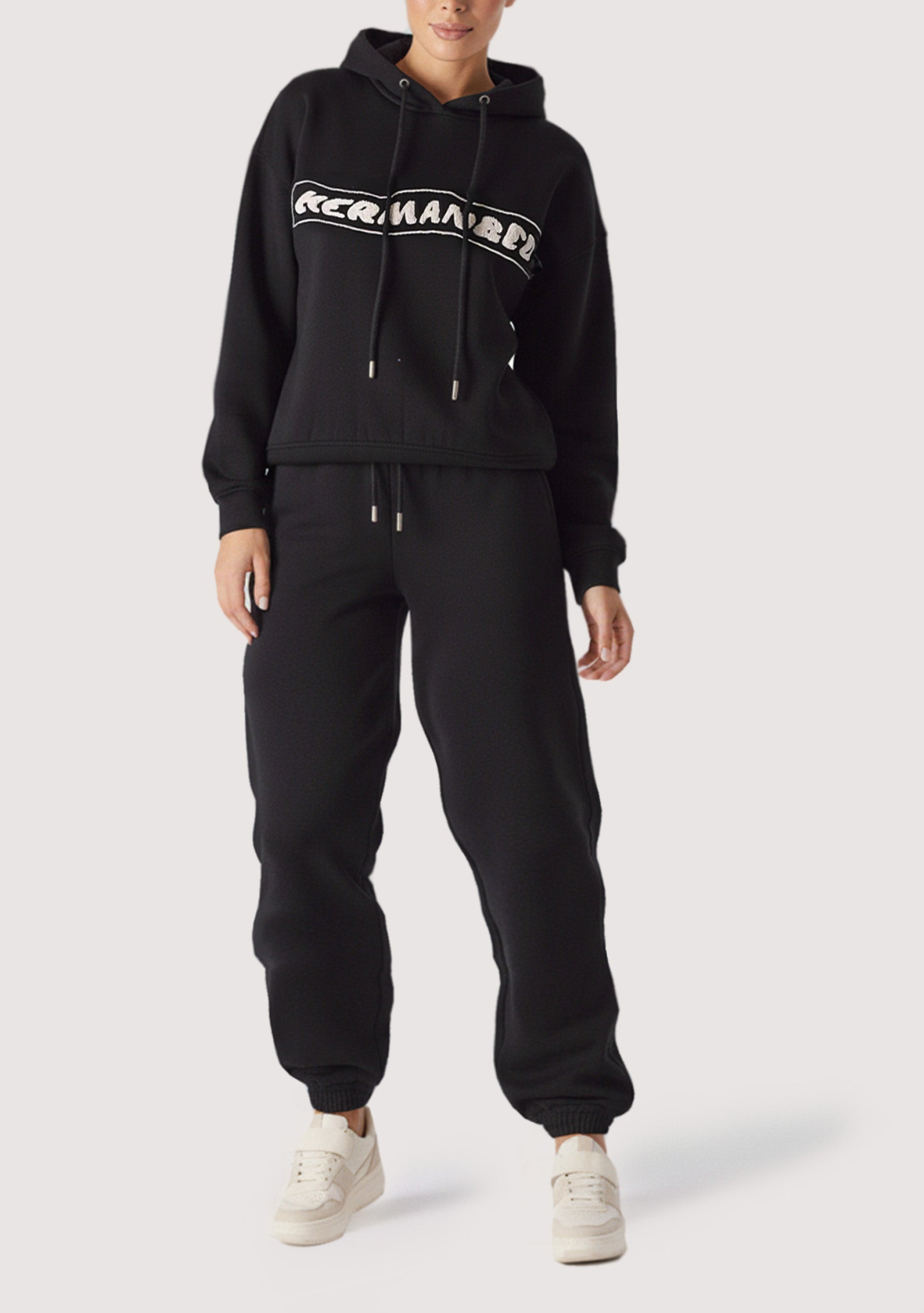 Full length shot of a woman in a premium oversized hoodie black.