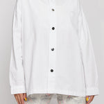 Oversized white shirt collar and logo close up