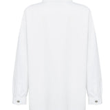 Oversized white shirt logo embroidery close up