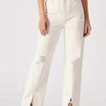 White pants worn by a person on a white background