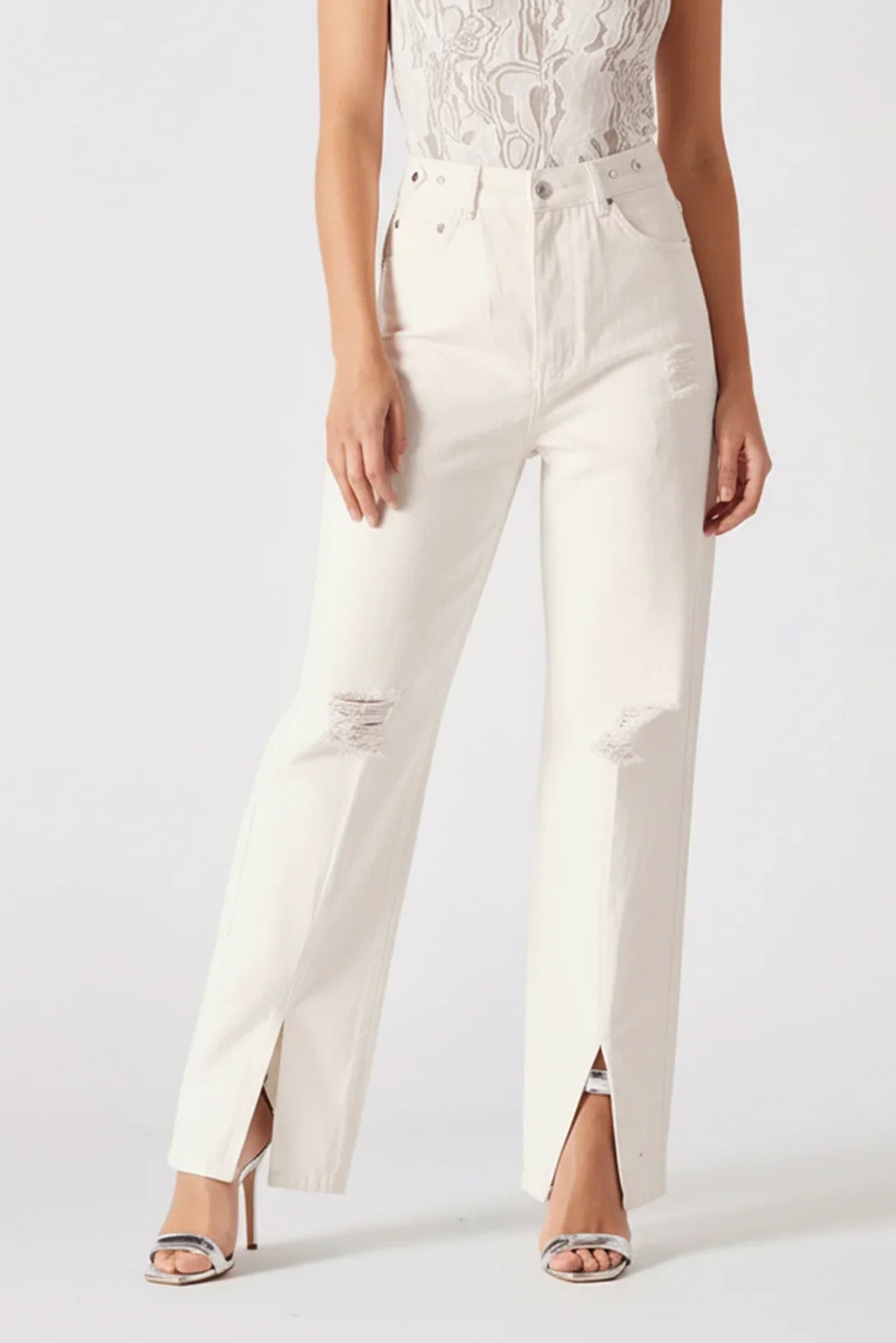 White pants worn by a person on a white background