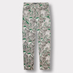 Front view of the printed jeans for men laid flat.