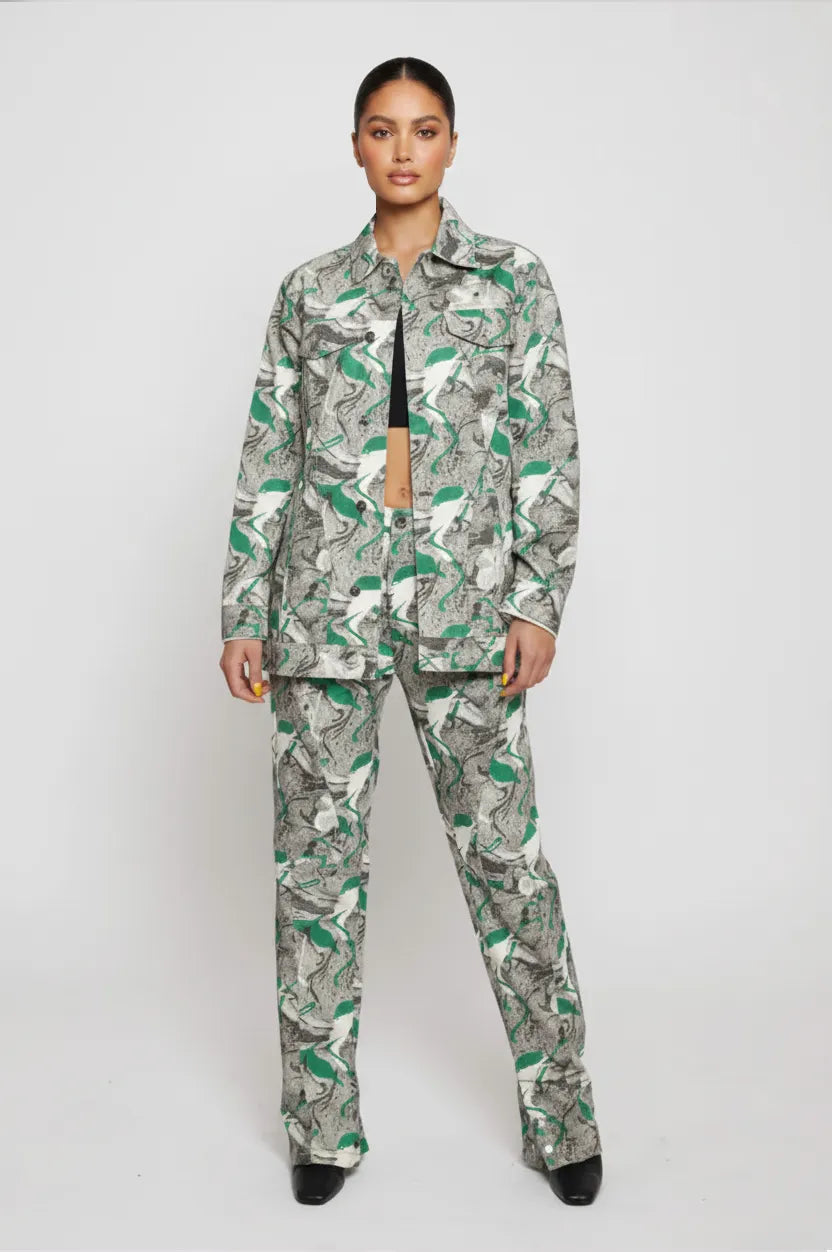 Slight pose front view of psychedelic print denim jacket showing chest pockets and collar - women’s oversized abstract swirl two-piece set