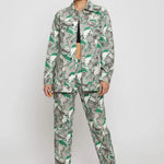 Slight pose front view of psychedelic print denim jacket showing chest pockets and collar - women’s oversized abstract swirl two-piece set