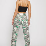 Back view of a model in the women's psychedelic print straight-leg jeans.