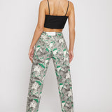 Back view of a model in the women's psychedelic print straight-leg jeans.