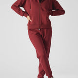 Front view of the premium red zip up hoodie womens showing the zipper detail.