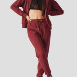 A model posing in the stylish red zip up hoodie womens for a casual UK look.