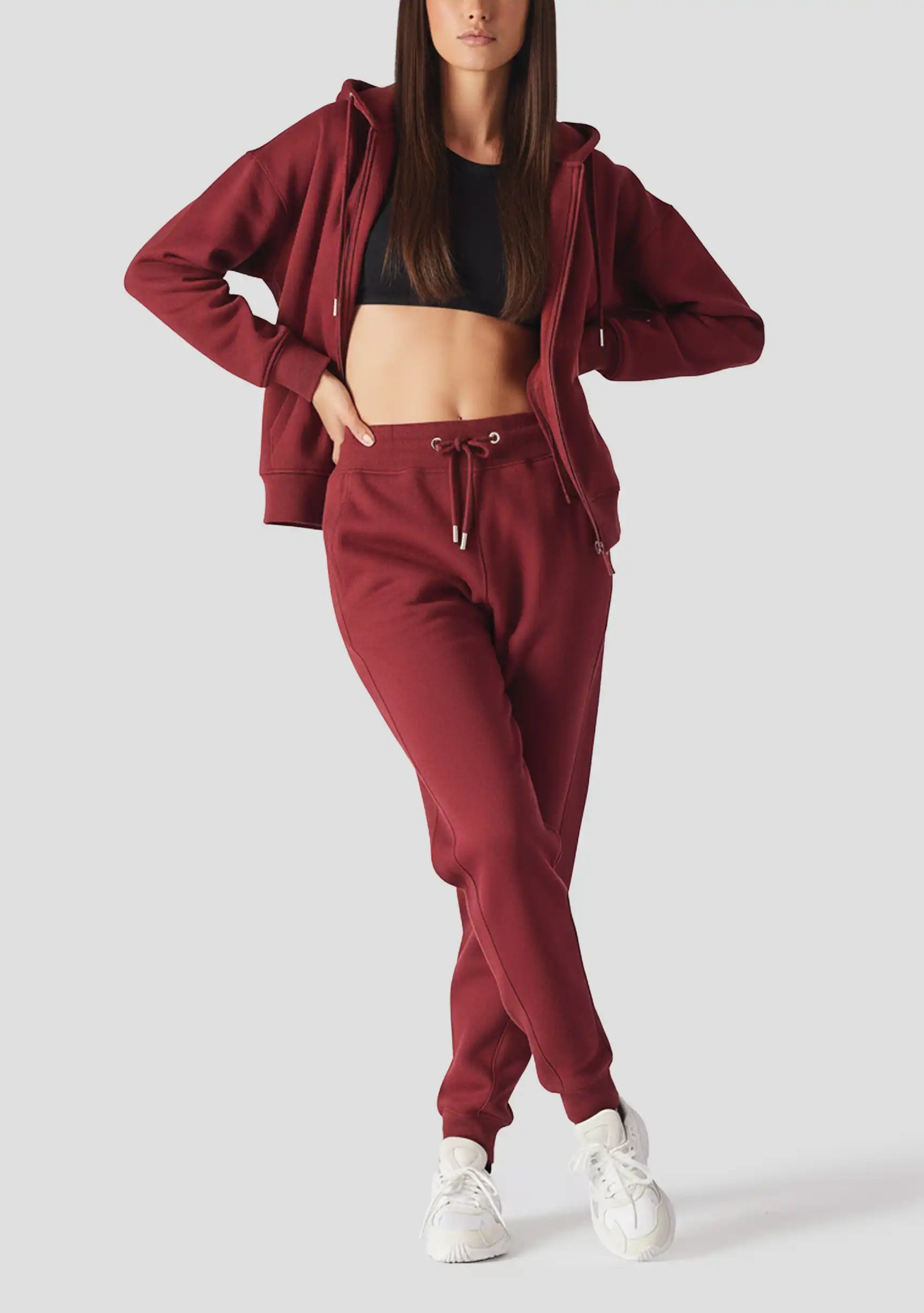 A model posing in the stylish red zip up hoodie womens for a casual UK look.