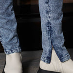 Detailed view of the zip opening at the ankle of the skinny jeans