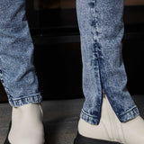 Detailed view of the zip opening at the ankle of the skinny jeans