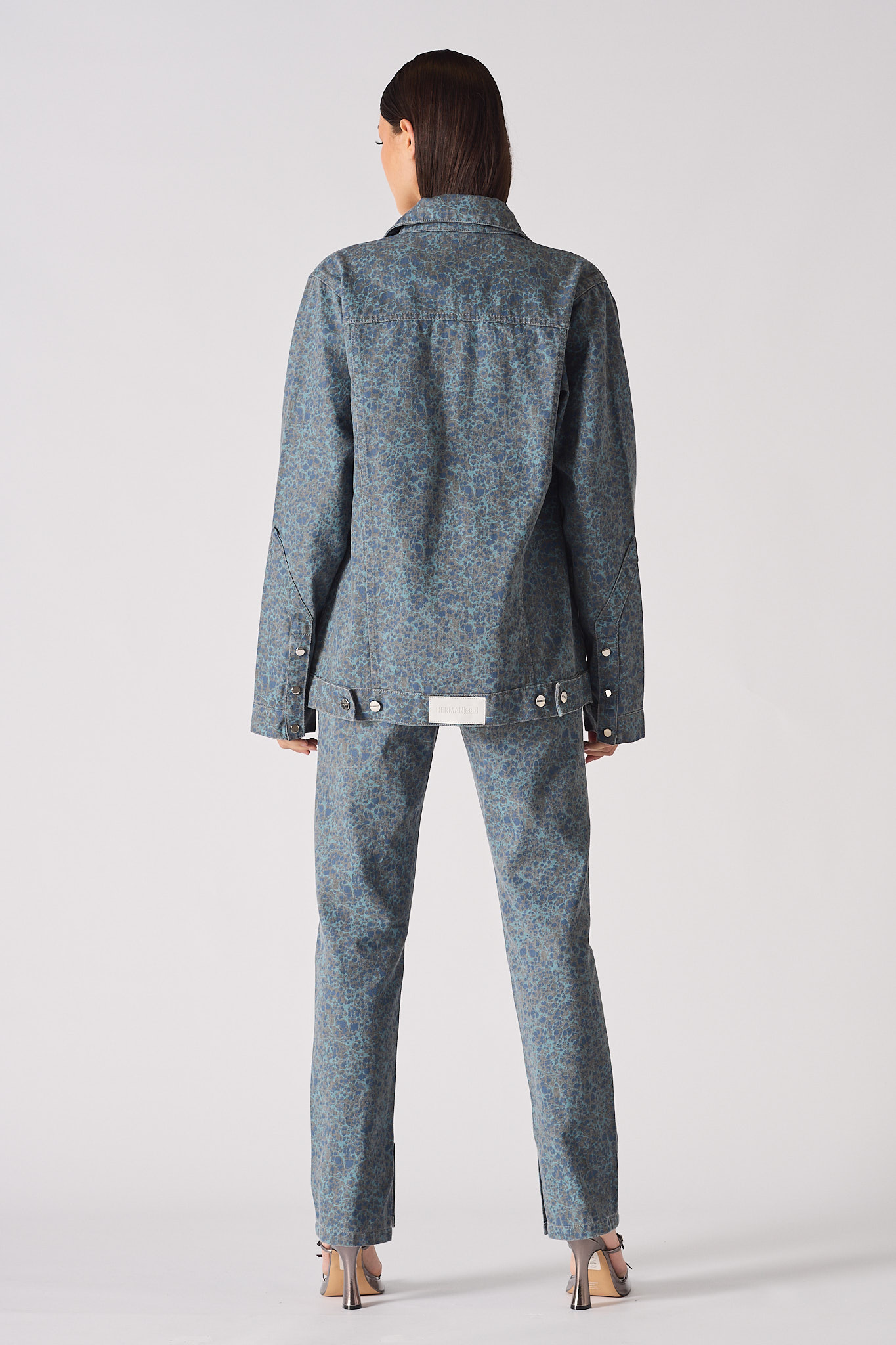 Back view of speckle print denim jacket showing Herman&Co label and blue grey mottled pattern detail - oversized cargo jacket
