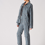 Side profile of speckle print denim jacket and cargo pants set - women's blue grey acid wash two-piece outfit with metallic platform heels