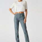 Model standing with one hand on hip wearing Speckled Wash Dark Blue Grey Denim Women's
