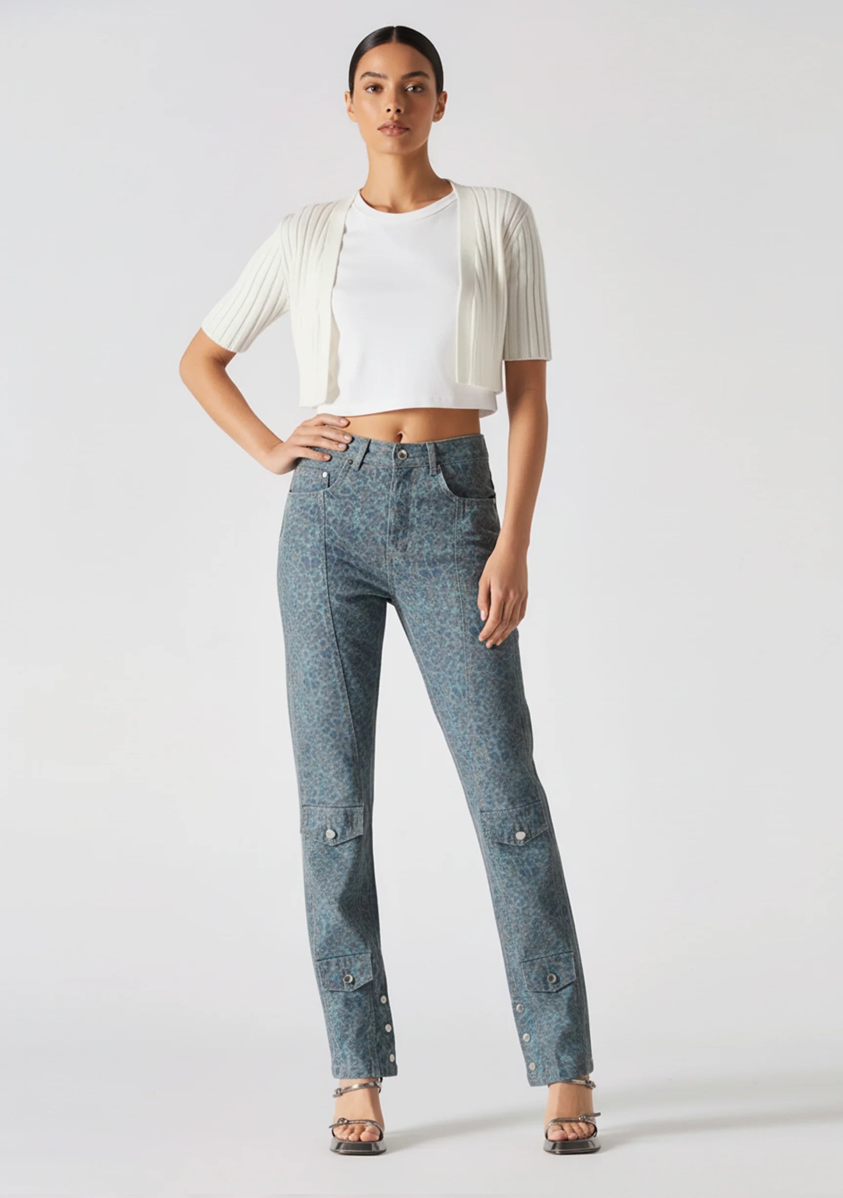 Model standing with one hand on hip wearing Speckled Wash Dark Blue Grey Denim Women's