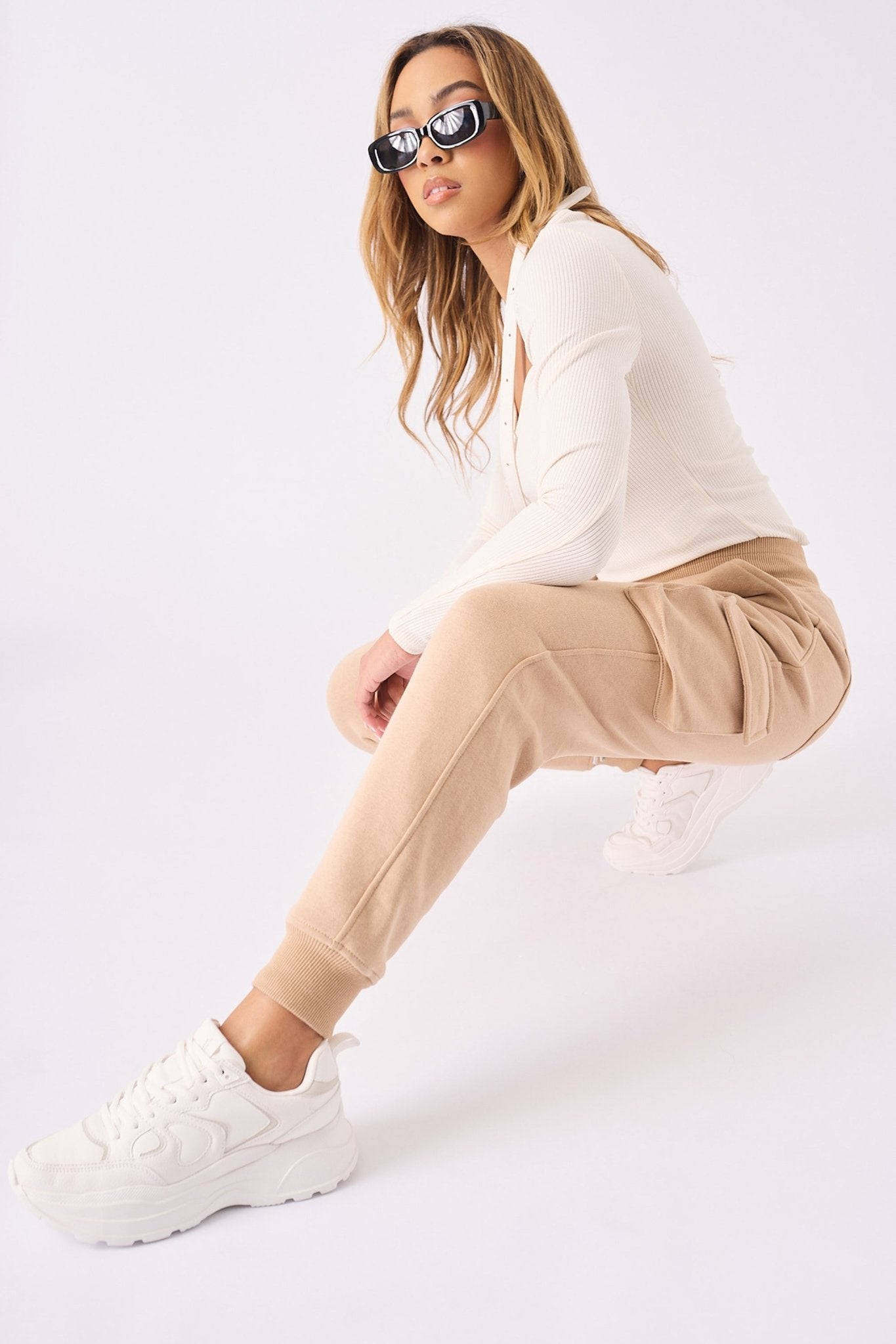 A woman wearing the stone relaxed fit jogger in a full front view.