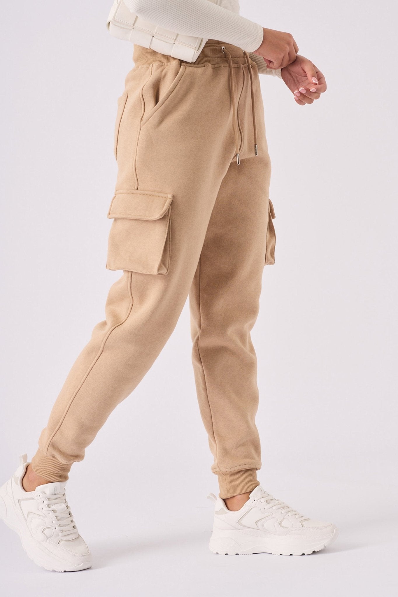 Model wearing the stone relaxed fit jogger for a modern casual UK look.