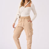 Side angle of a model wearing stylish stone relaxed fit jogger.