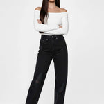 Model posing with arms crossed in Straight Fit Black Wash Denim Women's