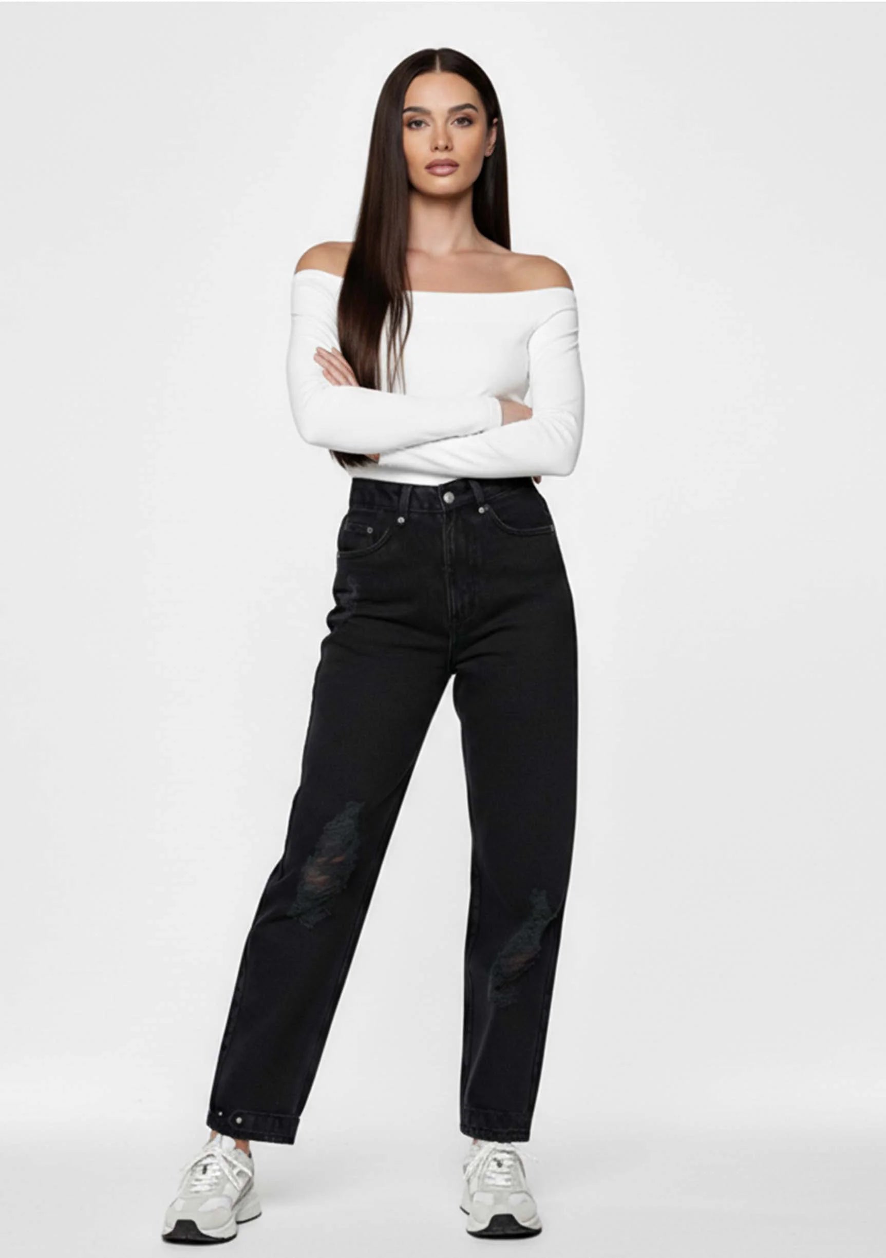 Model posing with arms crossed in Straight Fit Black Wash Denim Women's