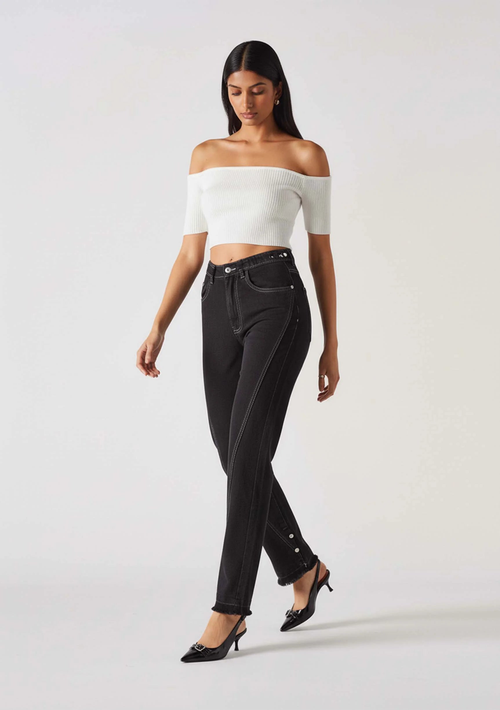Model walking to display the movement in Straight Leg Jeans with Poppers Black Wash