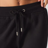 Close-up of the drawstring waist with silver toggles on the women's joggers