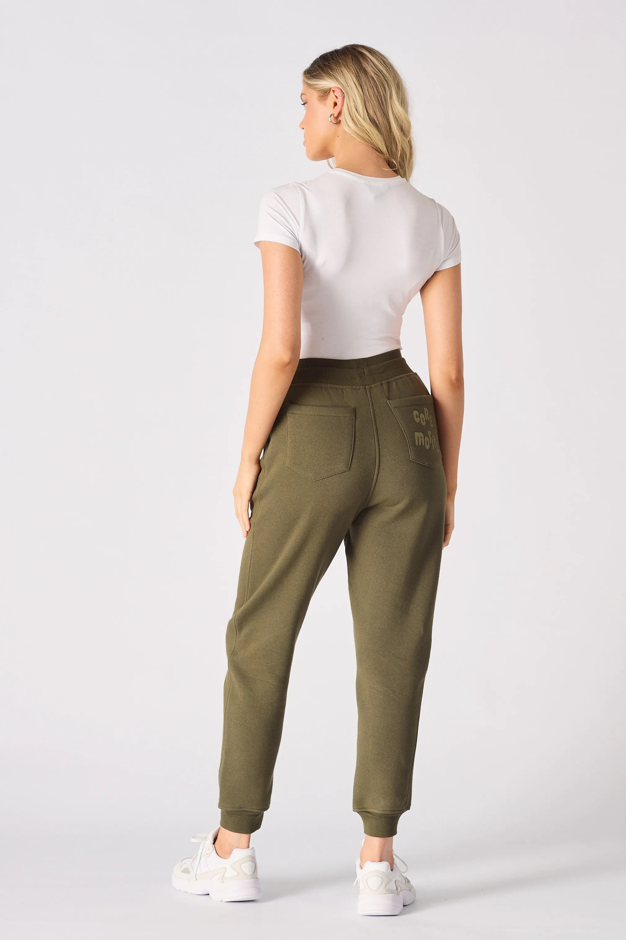 Rear view showing the clean fit of the tapered khaki joggers.