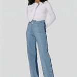 Model wearing high-waisted two-tone wide leg jeans with unique front seam details