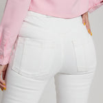Close up of the back pockets and high waist fit on white denim jeans