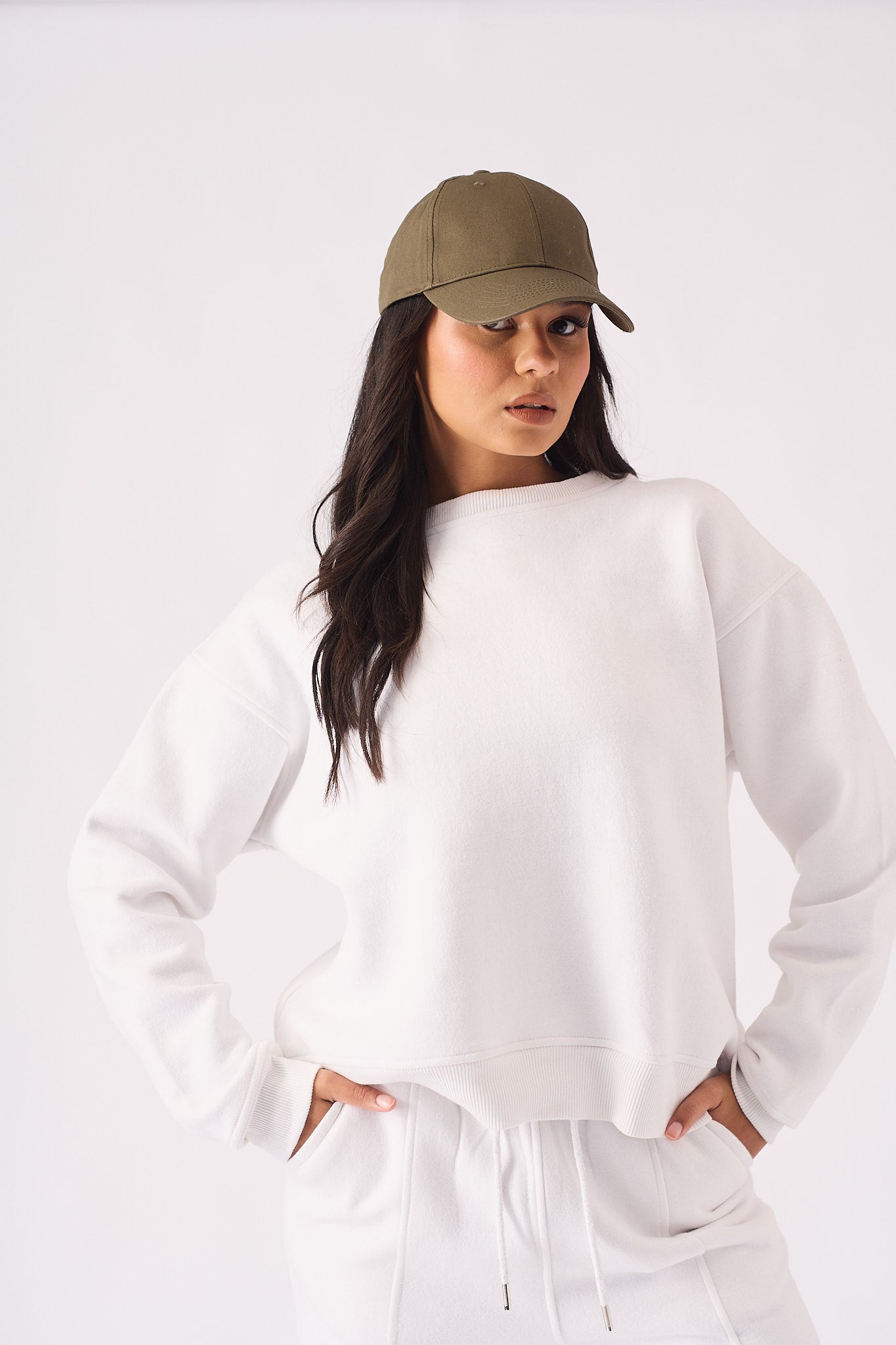 Front view of a high quality white crew neck jumper with a comfortable ribbed neckline