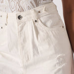 Macro shot of front pocket styling, coin pocket, and silver rivets on white jeans.