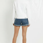 Back view of white denim trucker jacket for women showing clean design and regular fit