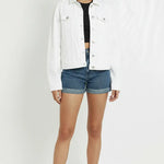 Full front view of white denim trucker jacket for women - classic collar, button front, chest pockets, regular fit